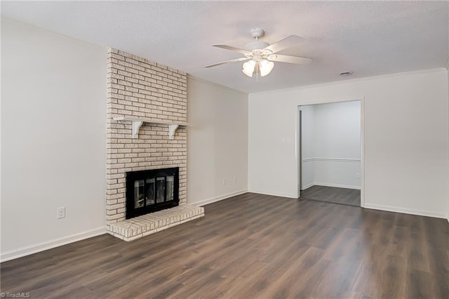 4814 Tower Rd, Greensboro, NC 27410 - unfurnished living room with ceiling fan, wood finished floors, baseboards, a textured ceiling, and a brick fireplace