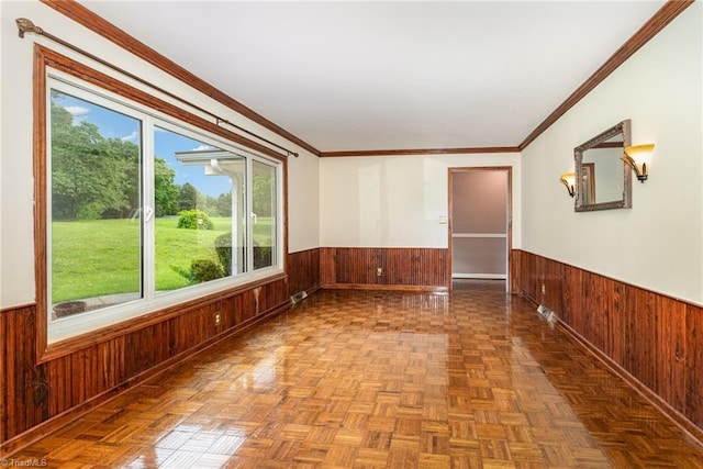 657 Spring St, Walnut Cove, NC 27052 - spare room featuring wainscoting, wood walls, and crown molding