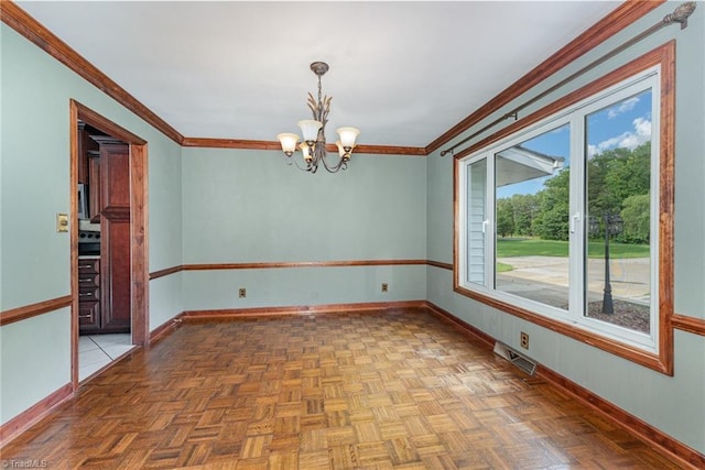 657 Spring St, Walnut Cove, NC 27052 - empty room featuring a chandelier, crown molding, and baseboards
