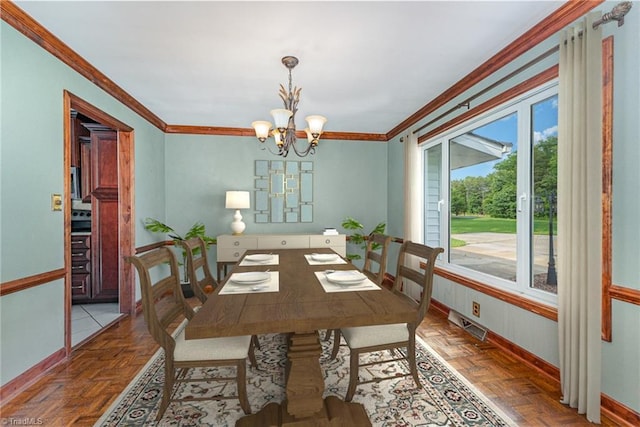 657 Spring St, Walnut Cove, NC 27052 - dining space featuring baseboards, ornamental molding, and a chandelier