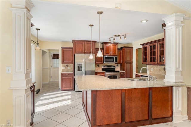 657 Spring St, Walnut Cove, NC 27052 - kitchen featuring stainless steel appliances, decorative columns, a peninsula, glass insert cabinets, and light stone countertops