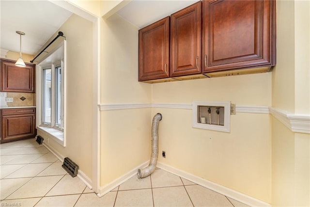 657 Spring St, Walnut Cove, NC 27052 - laundry area featuring washer hookup, light tile patterned floors, cabinet space, baseboards, and electric dryer hookup