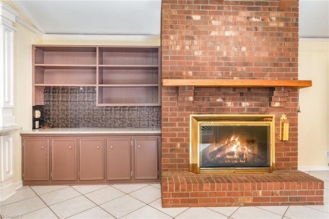 657 Spring St, Walnut Cove, NC 27052 - unfurnished living room featuring light tile patterned floors, crown molding, and a brick fireplace