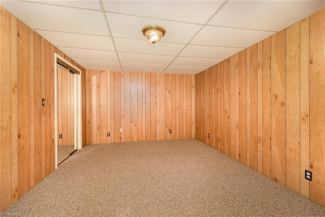 657 Spring St, Walnut Cove, NC 27052 - unfurnished room with carpet, wood walls, and a paneled ceiling