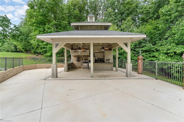 657 Spring St, Walnut Cove, NC 27052 - view of patio featuring ceiling fan and view of wooded area
