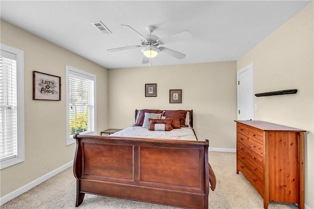 bedroom featuring visible vents, ceiling fan, light carpet, and baseboards