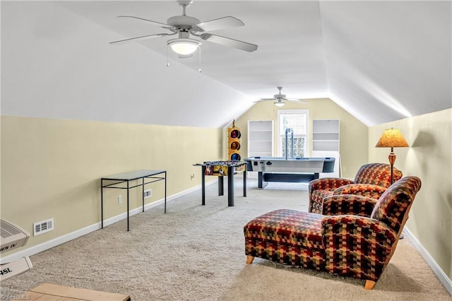 sitting room featuring light carpet, baseboards, visible vents, and lofted ceiling