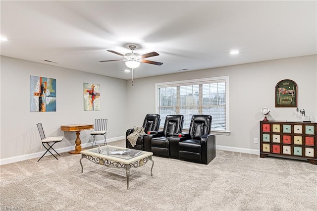 living room with carpet floors and ceiling fan