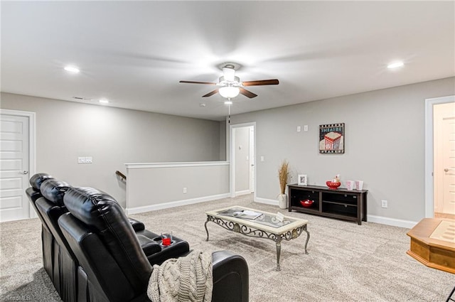 living room with ceiling fan and light colored carpet