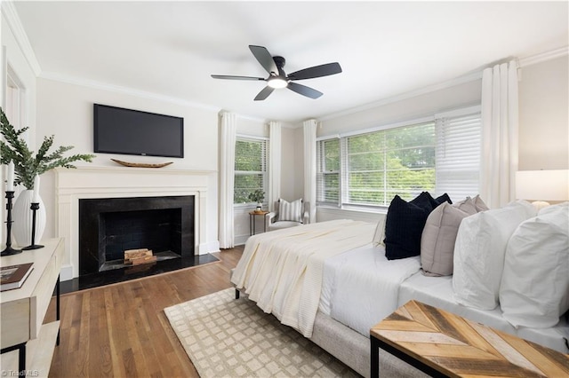 252 Lucerne Ln NW, Winston-Salem, NC 27104 - bedroom featuring crown molding, wood finished floors, a fireplace, and ceiling fan