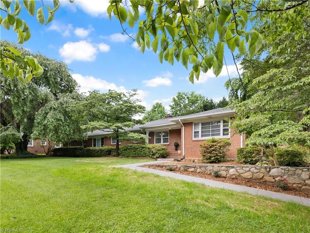 252 Lucerne Ln NW, Winston-Salem, NC 27104 - ranch-style house featuring brick siding and a front yard