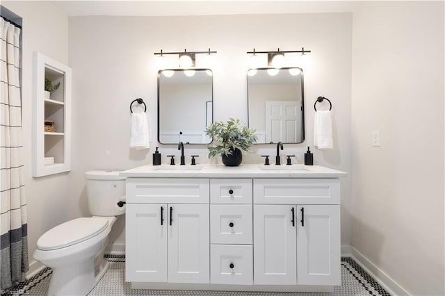 252 Lucerne Ln NW, Winston-Salem, NC 27104 - full bathroom with toilet, baseboards, double vanity, and tile patterned flooring
