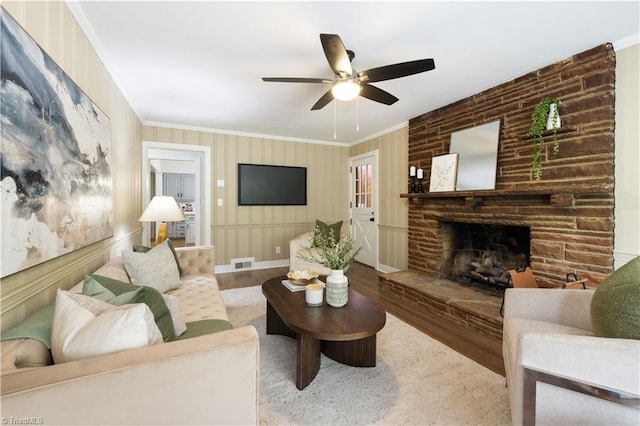 252 Lucerne Ln NW, Winston-Salem, NC 27104 - living room featuring crown molding, a fireplace, ceiling fan, and wood finished floors