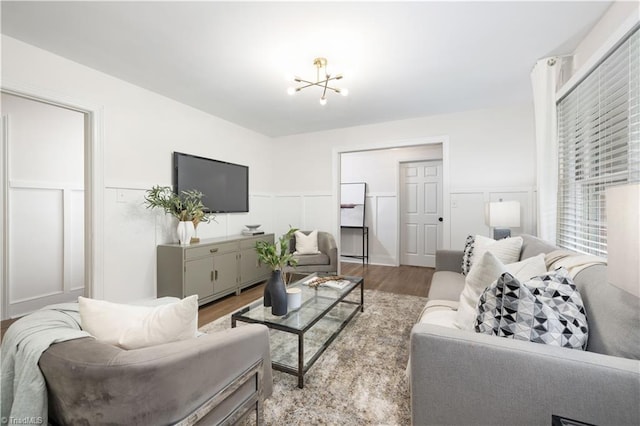 252 Lucerne Ln NW, Winston-Salem, NC 27104 - living area featuring wood finished floors, wainscoting, and a decorative wall