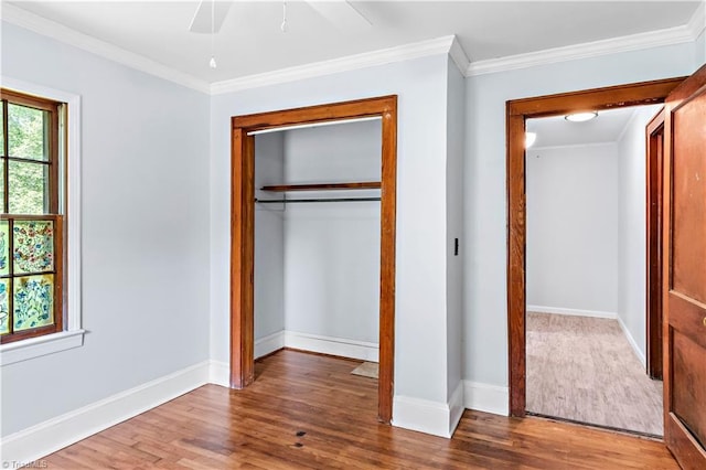 2226/2234 NC-268, Pilot Mountain, NC 27041 - unfurnished bedroom featuring wood finished floors, crown molding, a closet, baseboards, and a ceiling fan