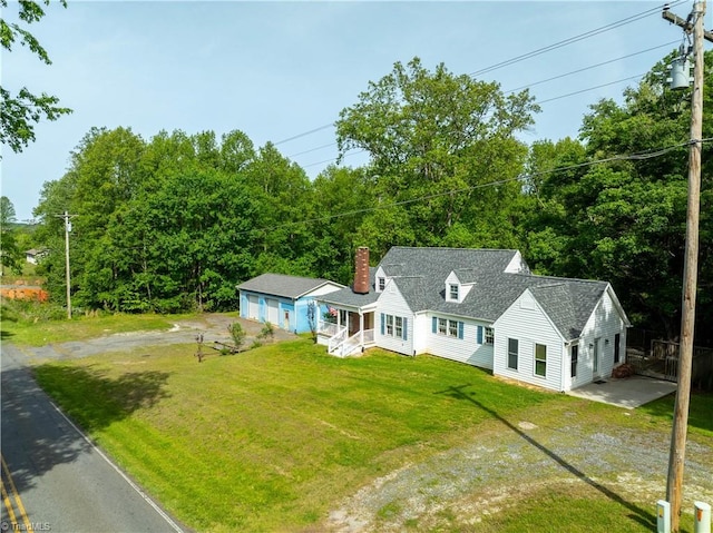 2226/2234 NC-268, Pilot Mountain, NC 27041 - new england style home with dirt driveway, a chimney, a front lawn, and roof with shingles