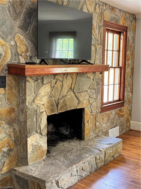 2226/2234 NC-268, Pilot Mountain, NC 27041 - detailed view of wood finished floors, a stone fireplace, and baseboards
