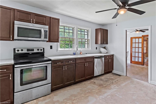 2226/2234 NC-268, Pilot Mountain, NC 27041 - kitchen with stainless steel appliances, a sink, light countertops, dark brown cabinetry, and ceiling fan