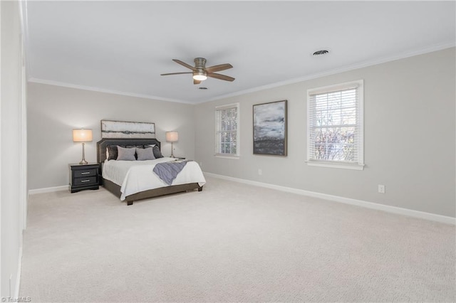 bedroom featuring light colored carpet, ceiling fan, and crown molding