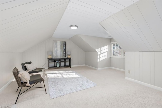 additional living space with light carpet and vaulted ceiling