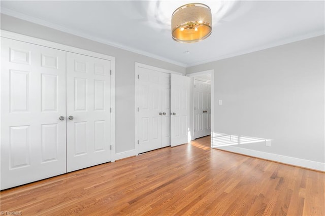 unfurnished bedroom featuring light hardwood / wood-style floors and ornamental molding