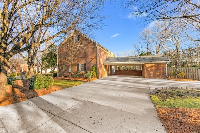 view of front of home featuring a carport