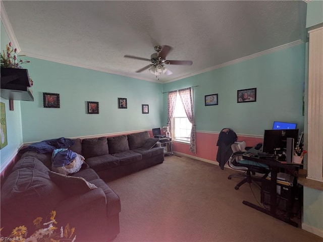 carpeted living room featuring a textured ceiling, ceiling fan, baseboards, and crown molding