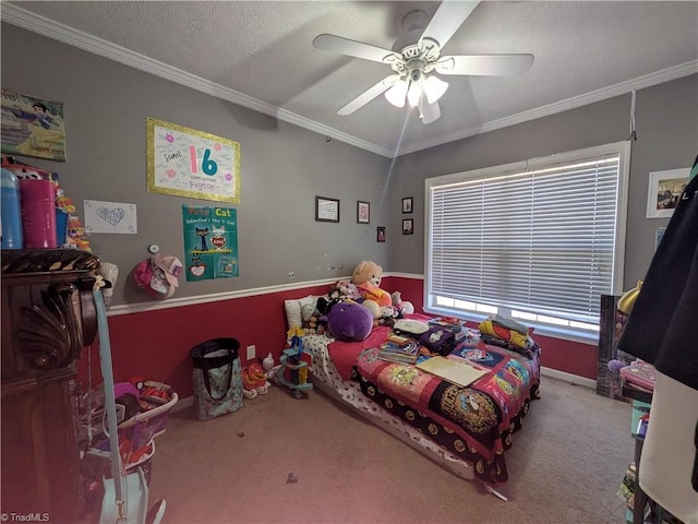 carpeted bedroom with a textured ceiling, a ceiling fan, and crown molding