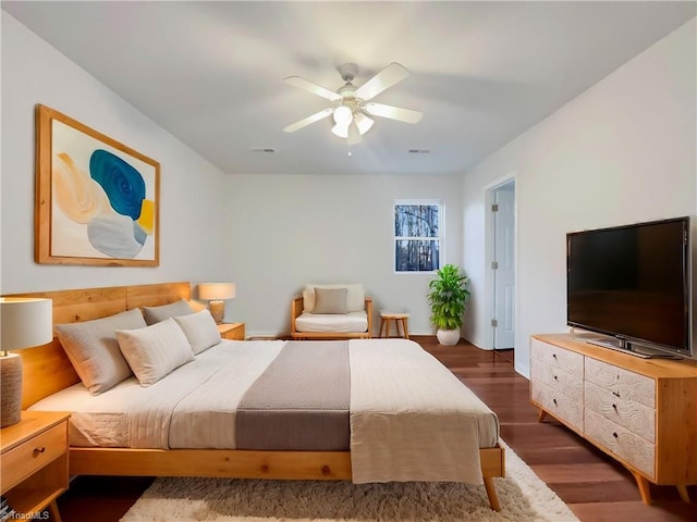 bedroom featuring dark hardwood / wood-style flooring and ceiling fan