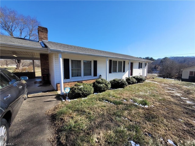 view of front of house featuring a carport