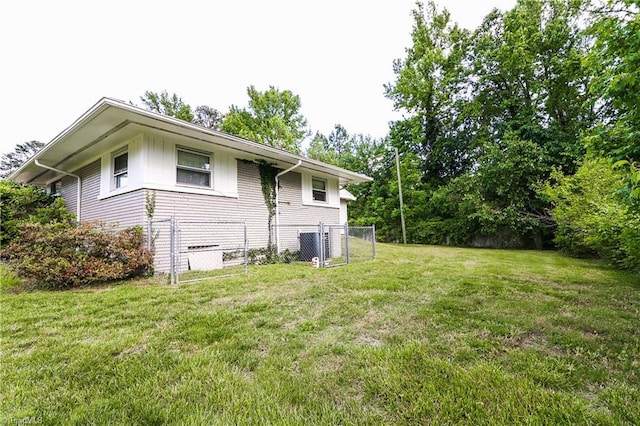 view of property exterior featuring board and batten siding and central AC