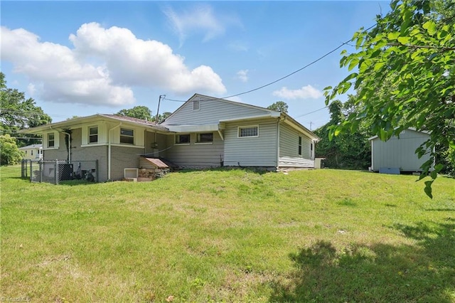 1402 Wendell Ave, High Point, NC 27260 - back of property featuring a lawn and brick siding