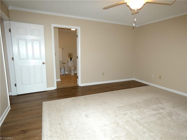 3982 Westridge Meadow Cir, Clemmons, NC 27012 - unfurnished bedroom featuring crown molding, dark wood-type flooring, baseboards, ensuite bath, and ceiling fan