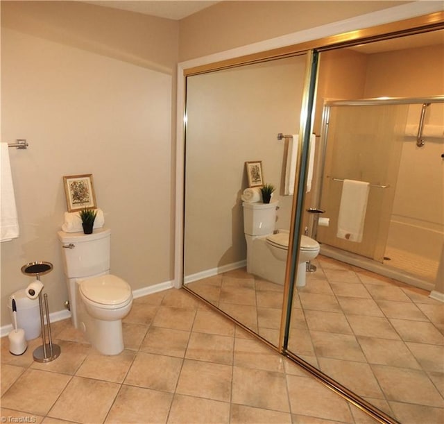 3982 Westridge Meadow Cir, Clemmons, NC 27012 - bathroom with toilet, a stall shower, tile patterned floors, and baseboards