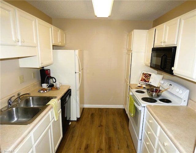3982 Westridge Meadow Cir, Clemmons, NC 27012 - kitchen with black appliances, a sink, dark wood finished floors, white cabinets, and light countertops