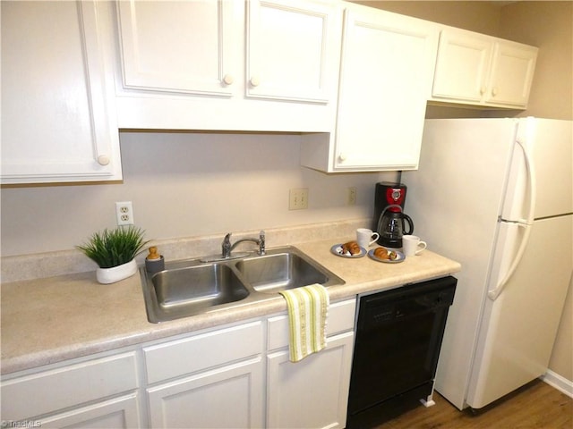 3982 Westridge Meadow Cir, Clemmons, NC 27012 - kitchen with dishwasher, freestanding refrigerator, white cabinetry, a sink, and light countertops