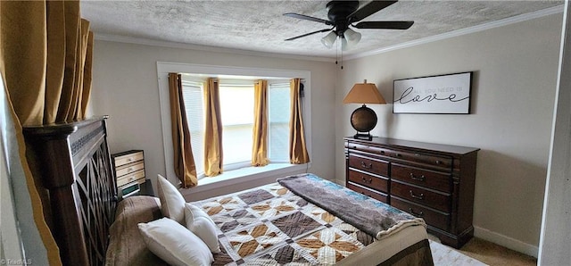 bedroom with a textured ceiling, ceiling fan, ornamental molding, and light colored carpet