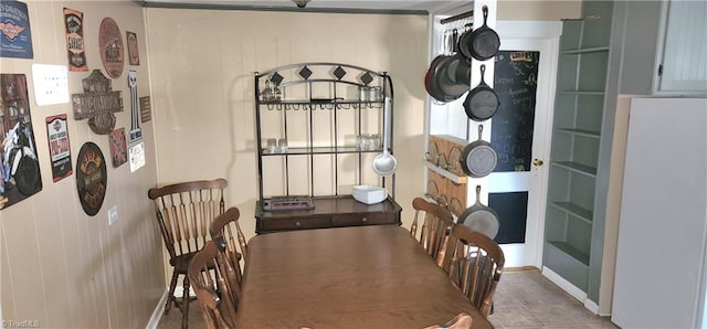 dining space featuring tile patterned floors