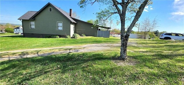 view of property exterior featuring a lawn