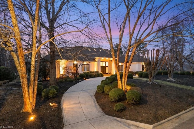 view of front of home with driveway and stucco siding