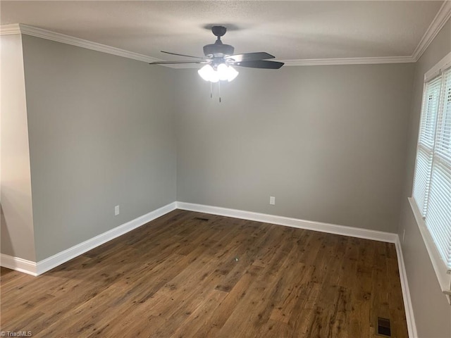 empty room with ceiling fan, crown molding, and hardwood / wood-style flooring