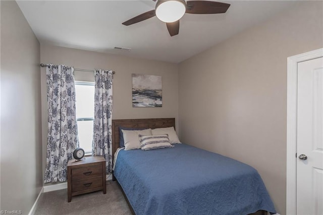 bedroom with a ceiling fan, carpet, visible vents, and baseboards