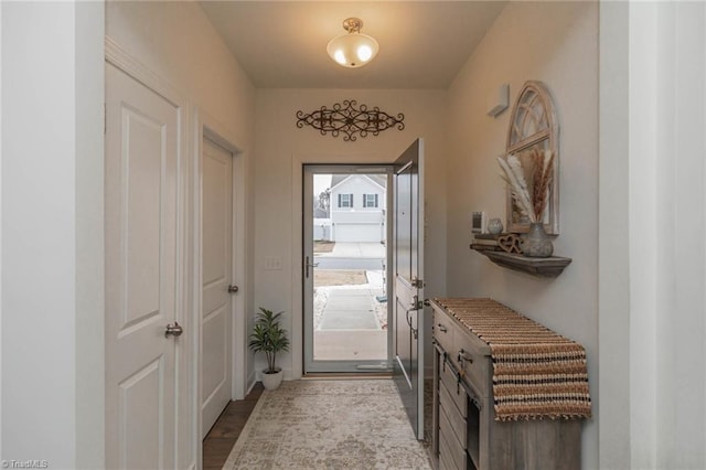 doorway to outside with wood finished floors