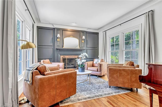 3940 Beechridge Rd, Winston-Salem, NC 27106 - sitting room with crown molding, wood finished floors, a decorative wall, and a brick fireplace