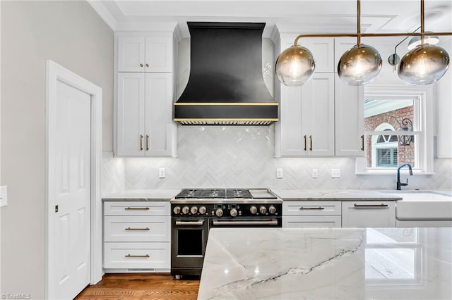 3940 Beechridge Rd, Winston-Salem, NC 27106 - kitchen with premium range hood, range with two ovens, light stone countertops, a sink, and white cabinets