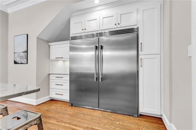 3940 Beechridge Rd, Winston-Salem, NC 27106 - kitchen with stainless steel built in fridge, light wood finished floors, white cabinetry, baseboards, and light stone counters