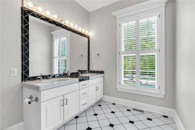 3940 Beechridge Rd, Winston-Salem, NC 27106 - bathroom featuring baseboards, double vanity, and crown molding