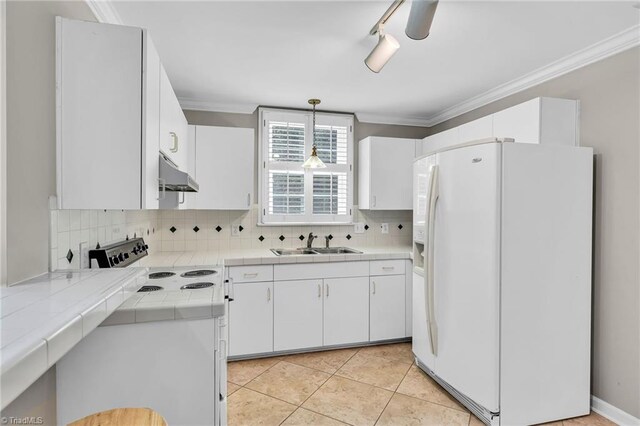 3940 Beechridge Rd, Winston-Salem, NC 27106 - kitchen with white refrigerator with ice dispenser, under cabinet range hood, a sink, electric stove, and tile countertops