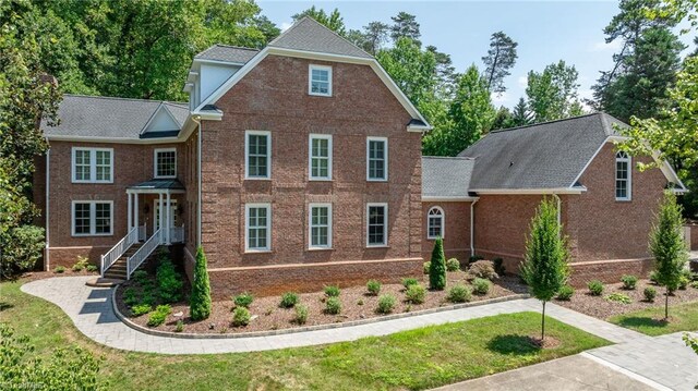 3940 Beechridge Rd, Winston-Salem, NC 27106 - view of front of property featuring brick siding and a front lawn