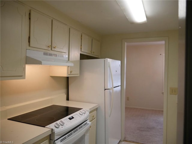 kitchen with white refrigerator, white cabinets, light carpet, and range with electric stovetop